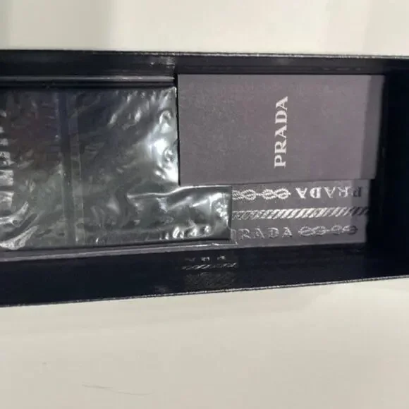 Prada 61mm Oval Sunglasses silver